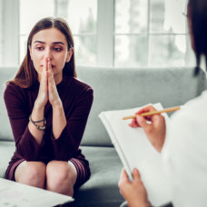 depressed woman consulting the doctor