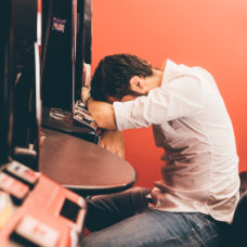 man sleeping inside a casino