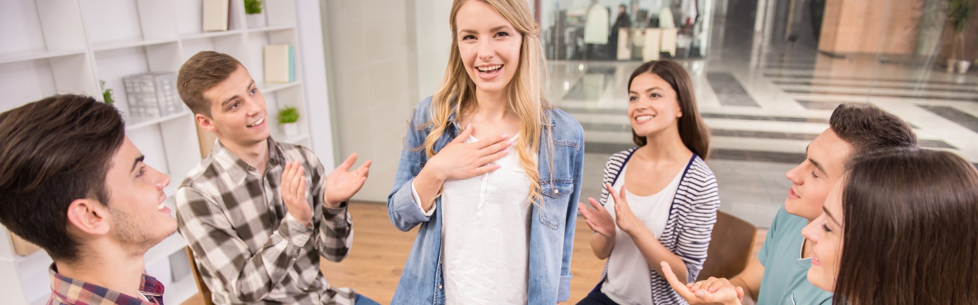 people clapping to the woman