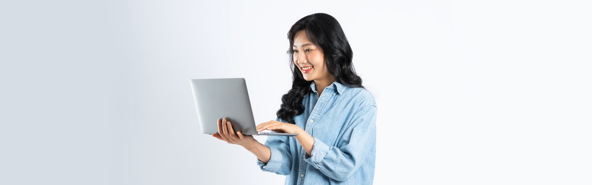 woman holding a laptop